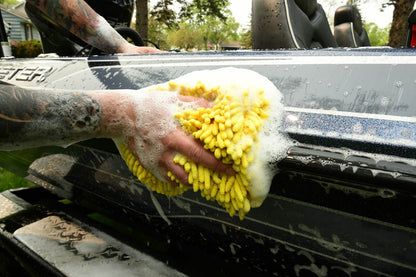 Boat washing with lots of foam and wash mit